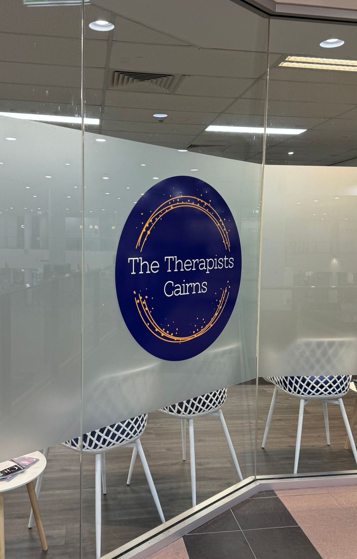 A Glass Door With A Company Sticker On It — The Therapists Cairns In Cairns City, QLD