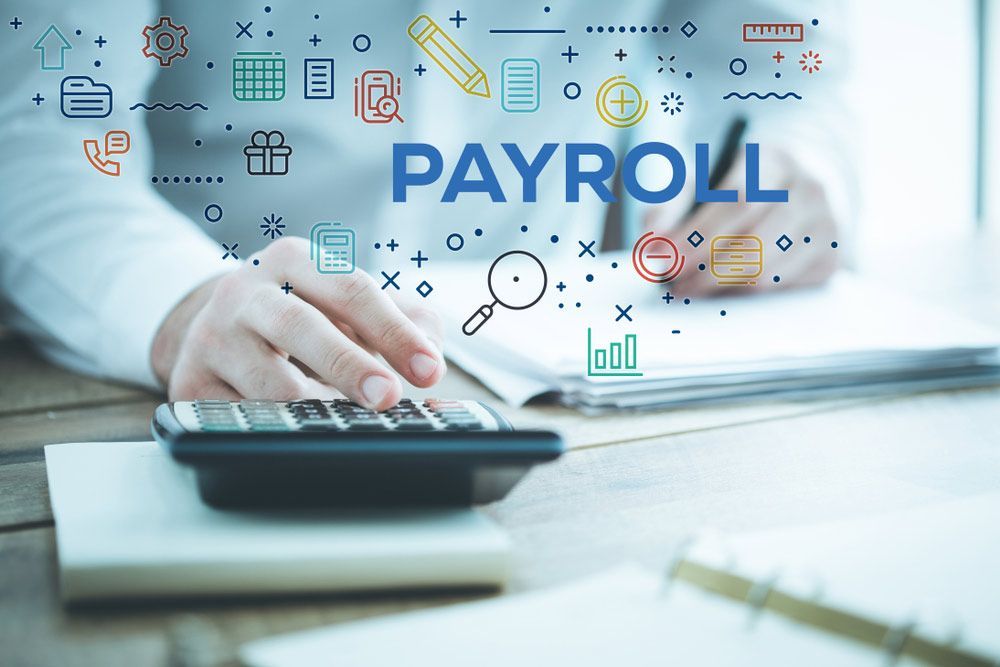 Accountant Is Using A Calculator And Writing On A Piece Of Paper — Dynamic Accounting Taxation Advisors in Terrigal, NSW