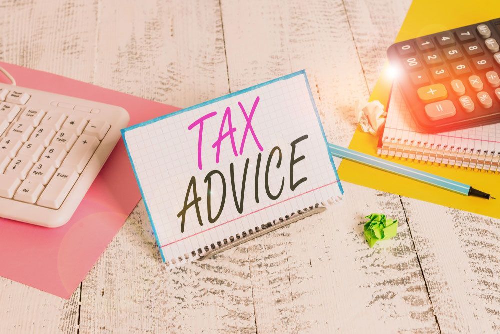 Tax Advice  Is Sitting On A Wooden Table — Dynamic Accounting Taxation Advisors in Terrigal, NSW
