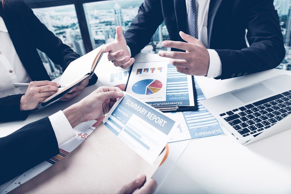 Group Of Business People Busy Discussing Financial Matter — Dynamic Accounting Taxation Advisors in Gosford, NSW