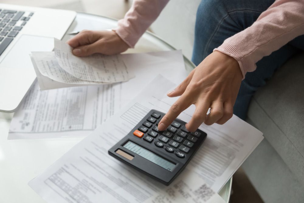 Bookkeeper Accountant Doing Paperwork — Dynamic Accounting Taxation Advisors in Wamberal, NSW