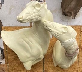 a statue of two deers hanging on a wall — Mountain Critters Taxidermy — Newville, PA