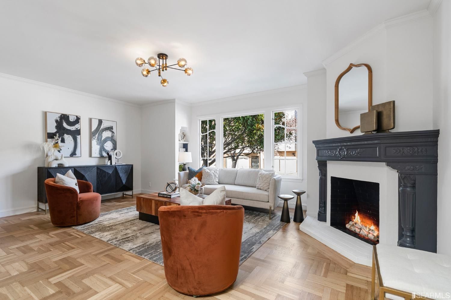 A living room filled with furniture and a fireplace.