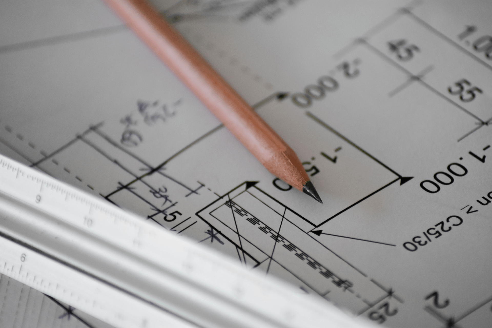 A pencil is pointing at a number on a drawing