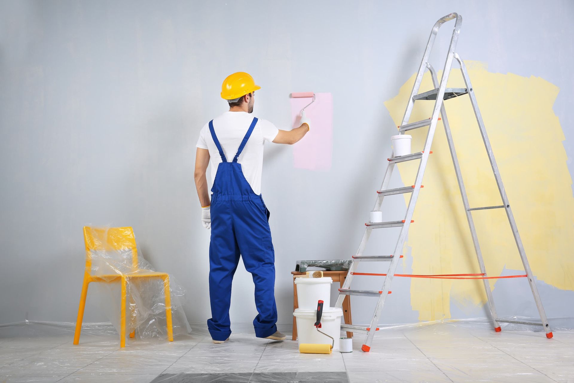 Man Painting The Wall
