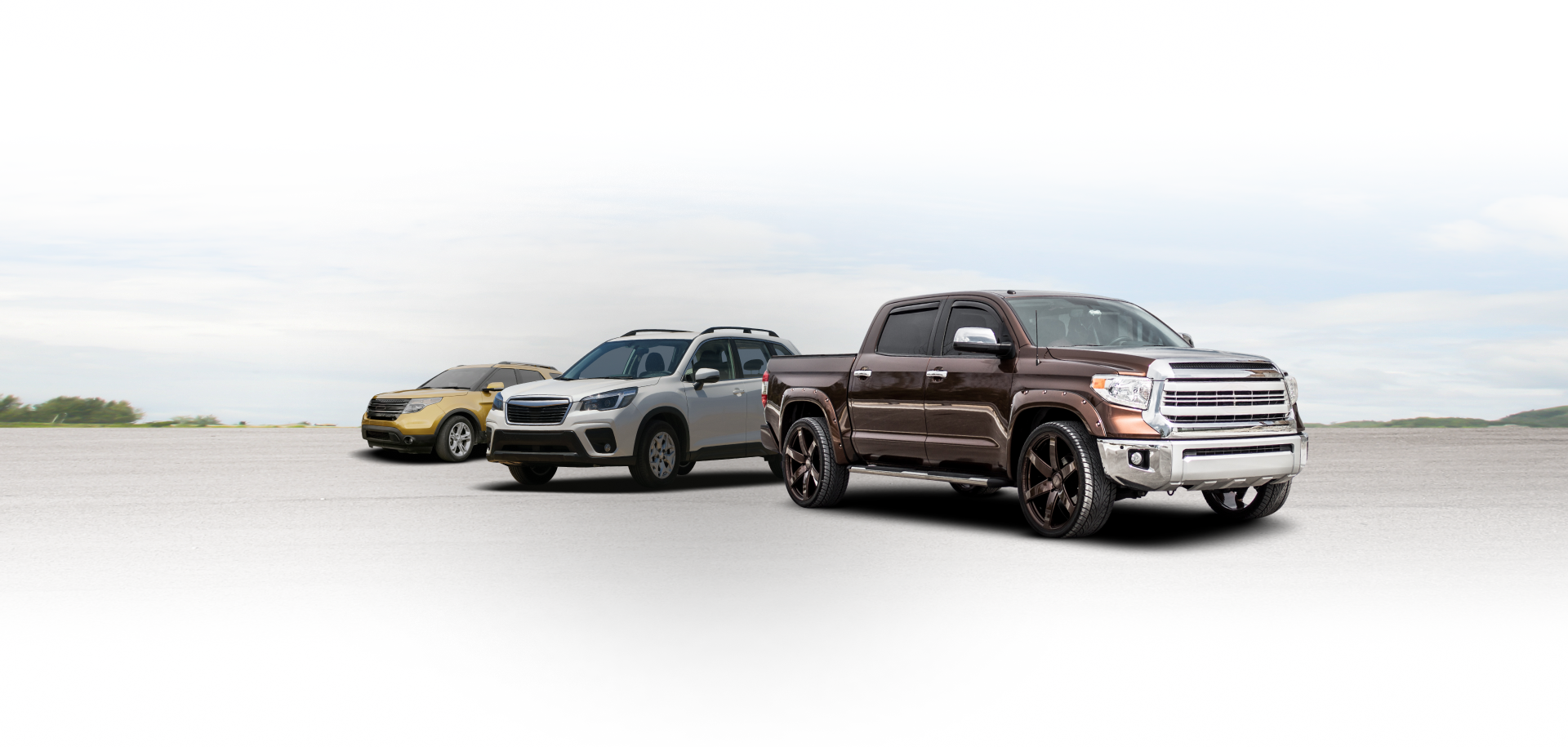 Three SUVs parked on a white beach under an overcast sky | The Family Mechanics - Cherry Hill