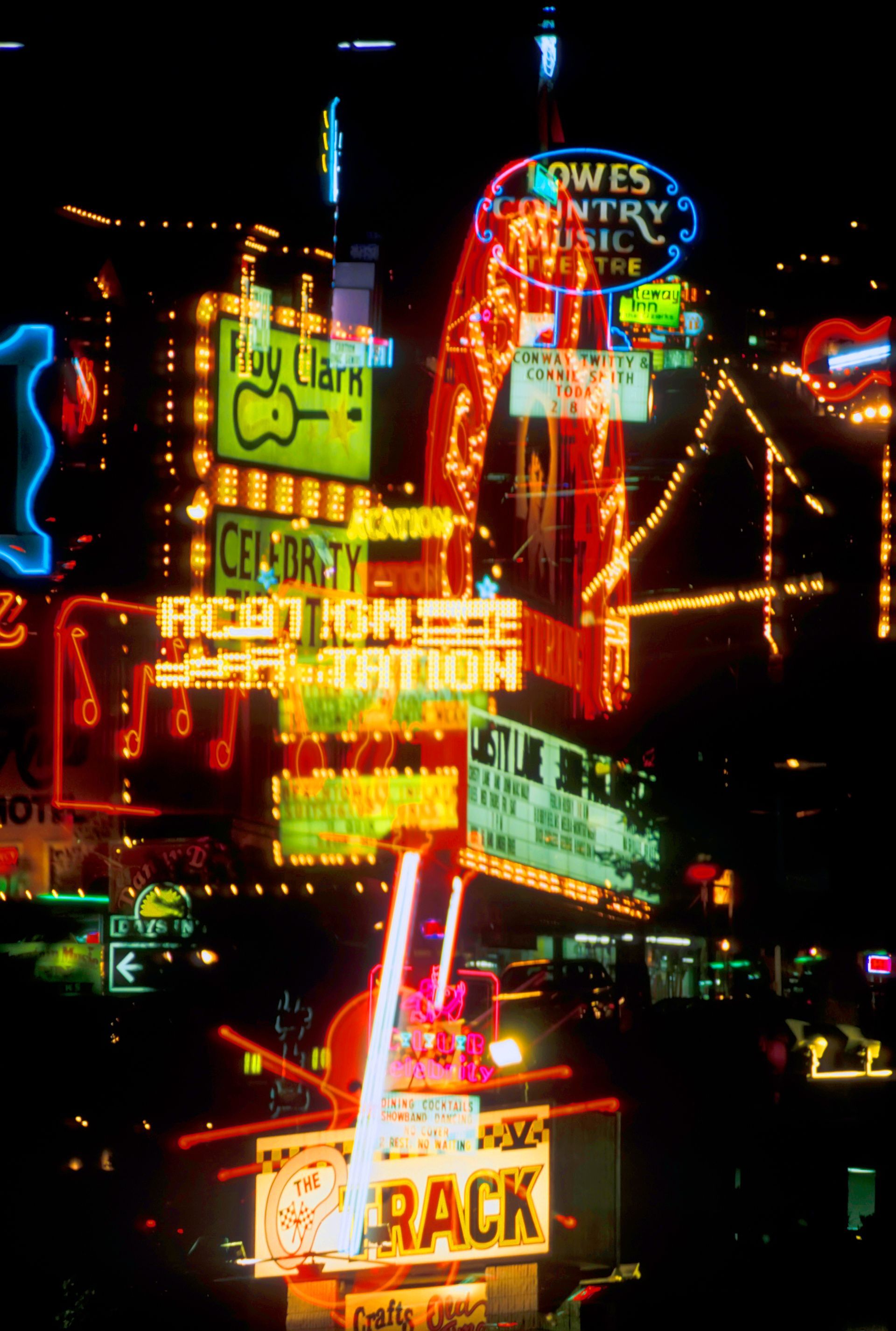 Bright neon signs at night: