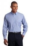 A man is wearing a light blue dress shirt and black pants.