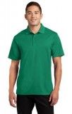A man is wearing a green polo shirt and black shorts.