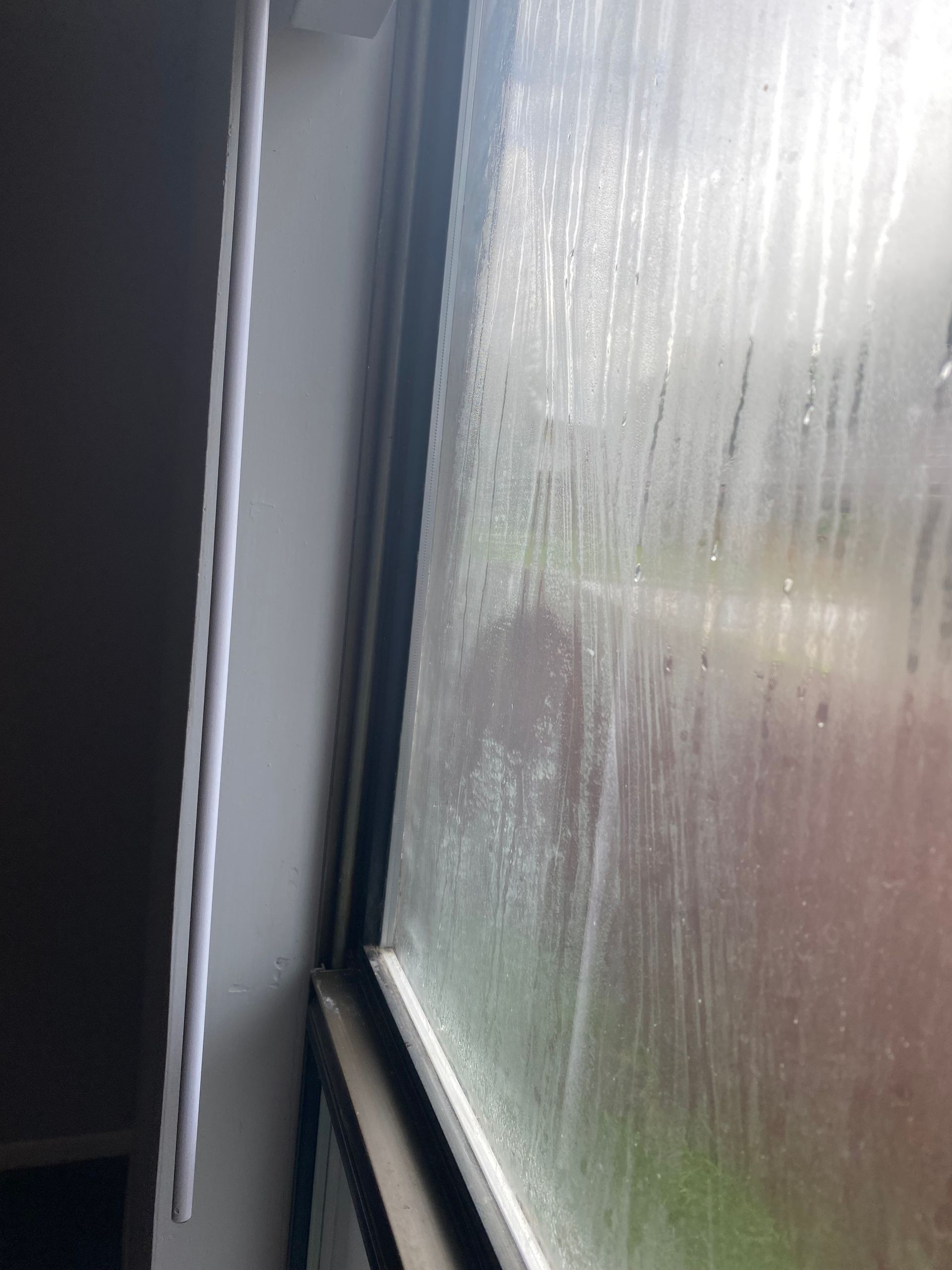 A window with a lot of condensation on it.