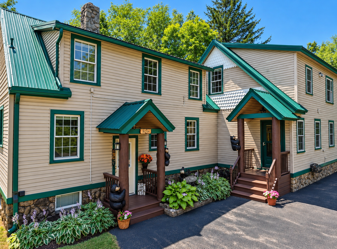 Exterior of the Red Fox and Little Bear Townhouses in Windham, NY, green metal roofs, covered entrances and landscaping.