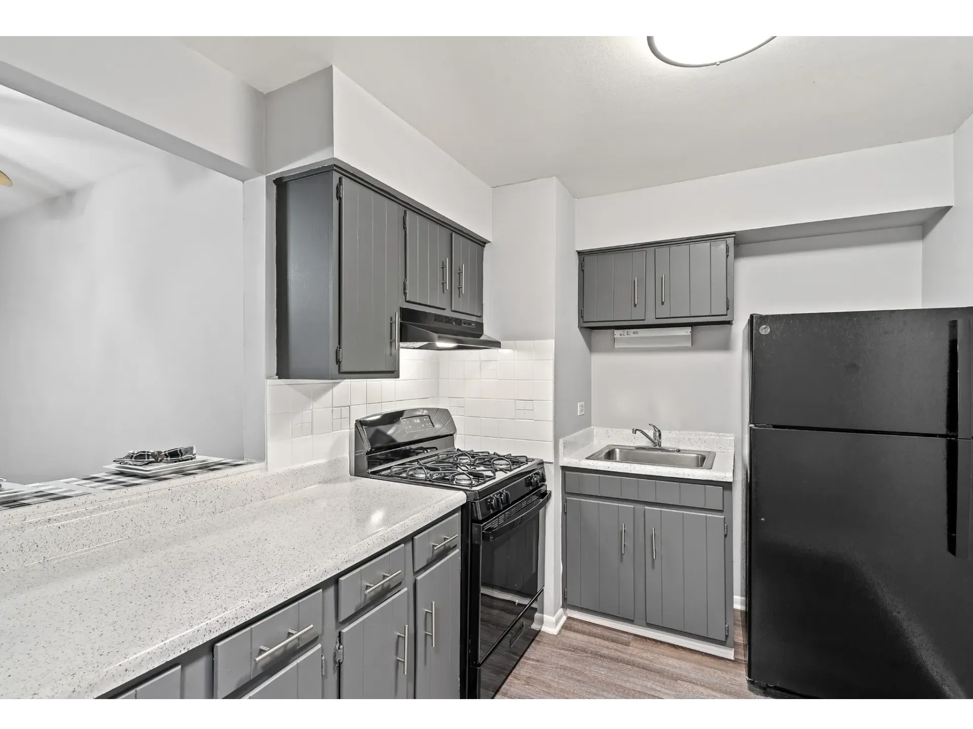 Modern kitchen with dark cabinets and appliances