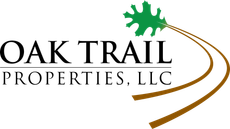 Oak Trail Properties, LLC logo with green oak leaf and brown curved trail lines