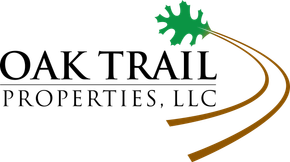 Oak Trail Properties, LLC logo with green oak leaf and brown curved trail lines