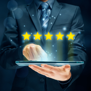 Businessperson tapping a tablet with five glowing stars, suggesting a top rating