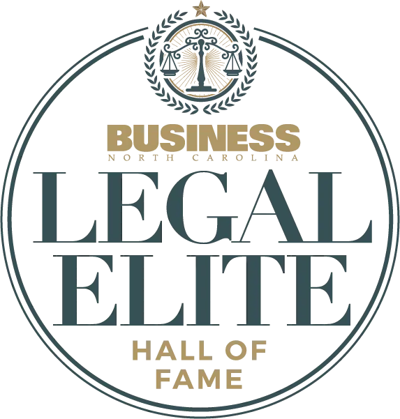 Business North Carolina Legal Elite Hall of Fame logo: scales of justice and laurel wreath within a circular design.