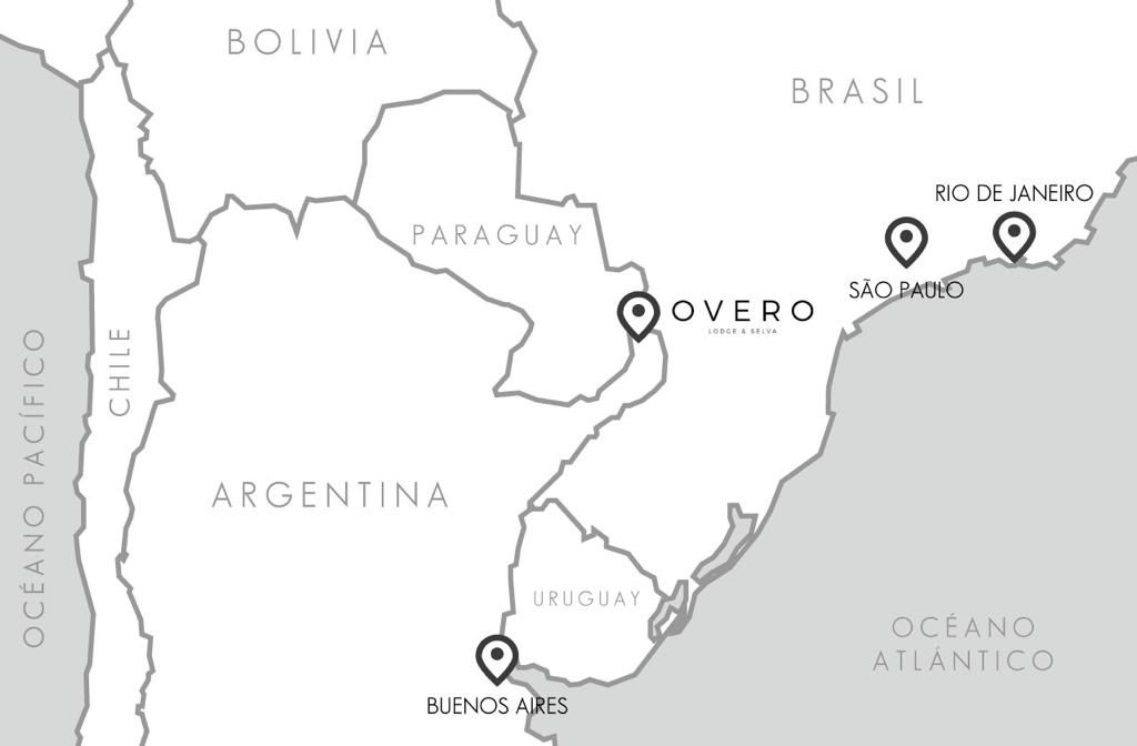 Mapa de Sudamérica con la ubicación destacada de Overo Iguazú en la región de Misiones, Argentina, cerca de las Cataratas.