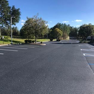 A Parking Lot With A Lot Of Parking Spaces — Spring Hill, FL — Gator State Paving & Masonry
