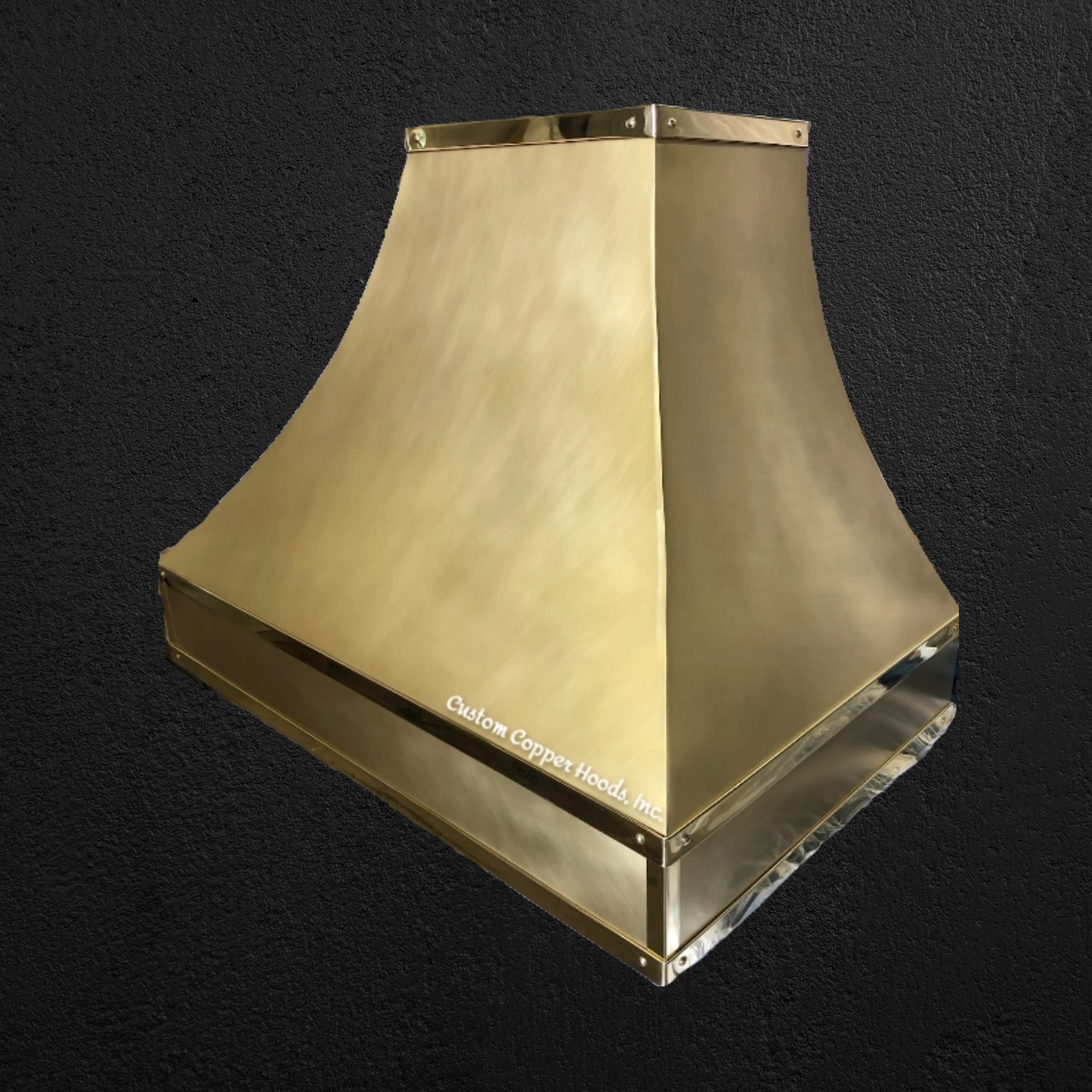 A stainless steel hood is sitting on a black surface