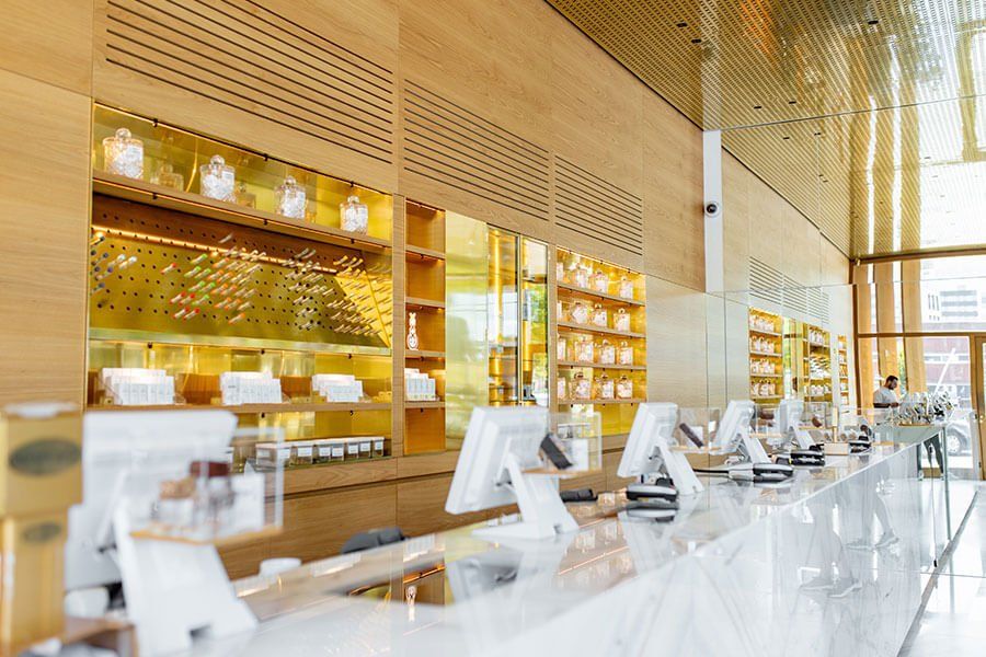 A pharmacy with a long counter and a lot of computers on it.