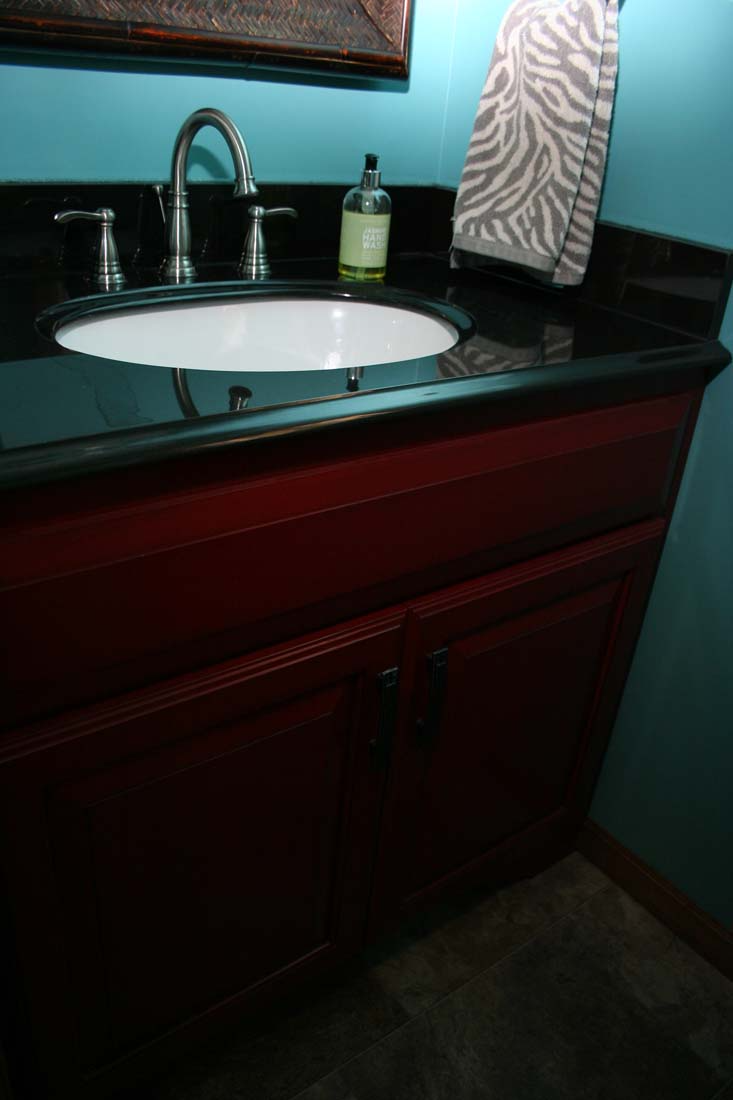 A bathroom with a sink and a towel on the counter