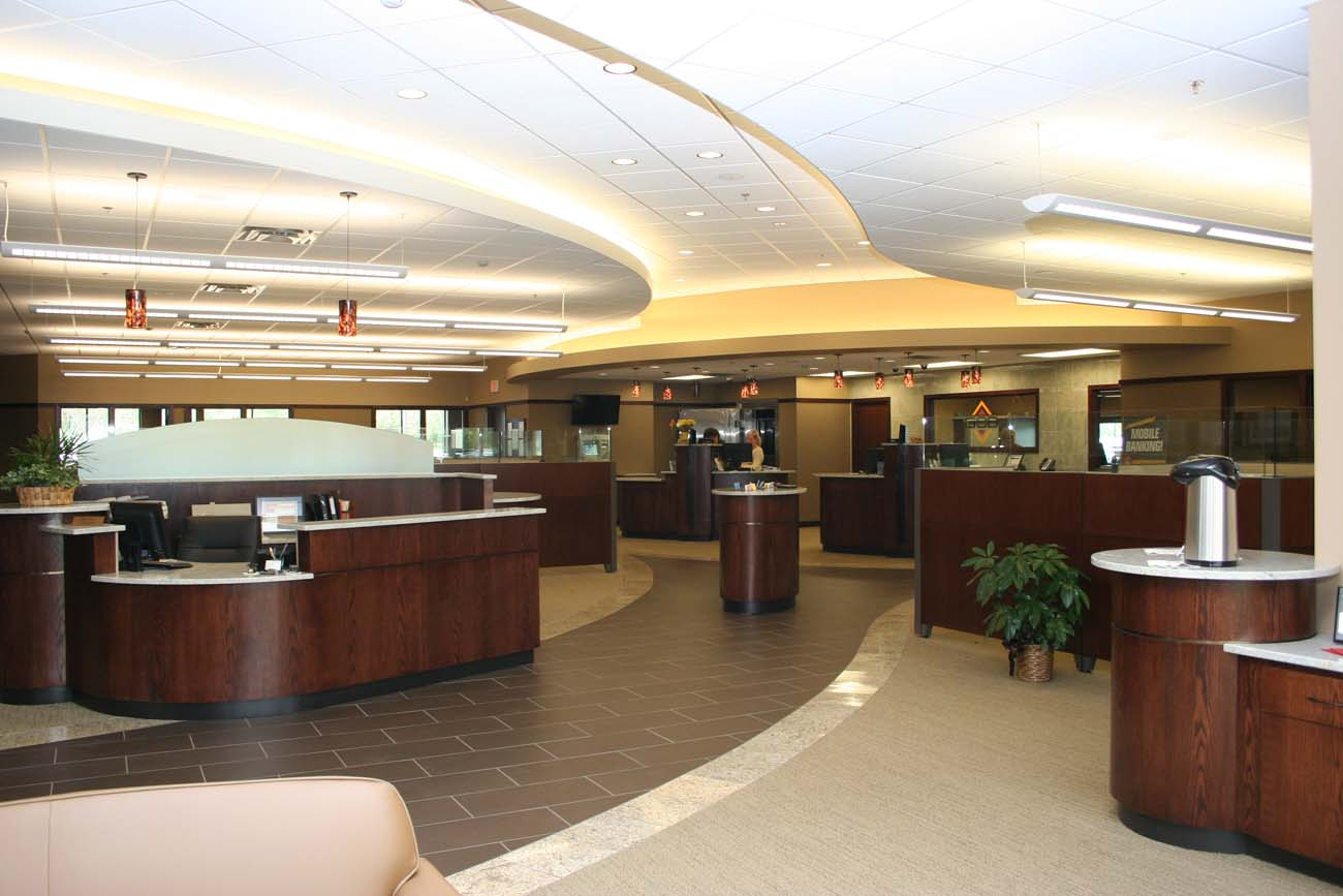 A bank with a lot of counters and tables