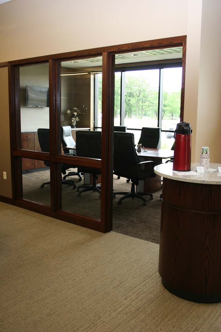 A conference room with a table and chairs in it
