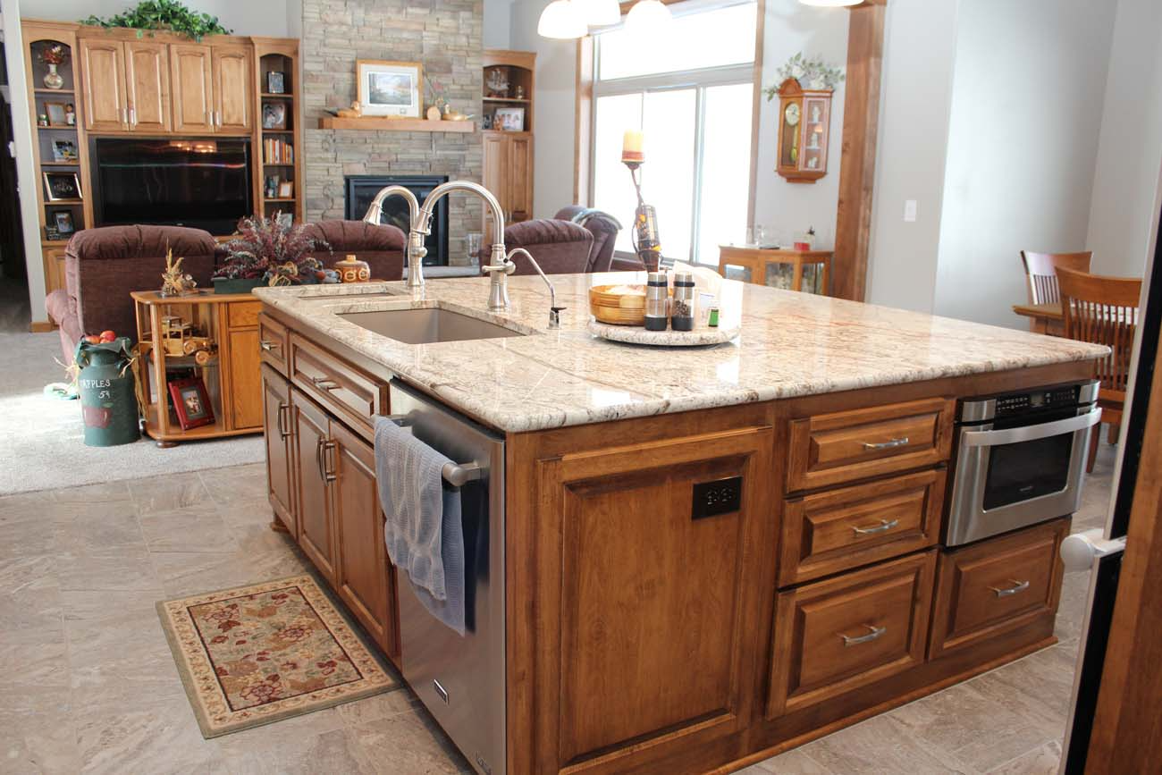 A kitchen with a large island and a sink