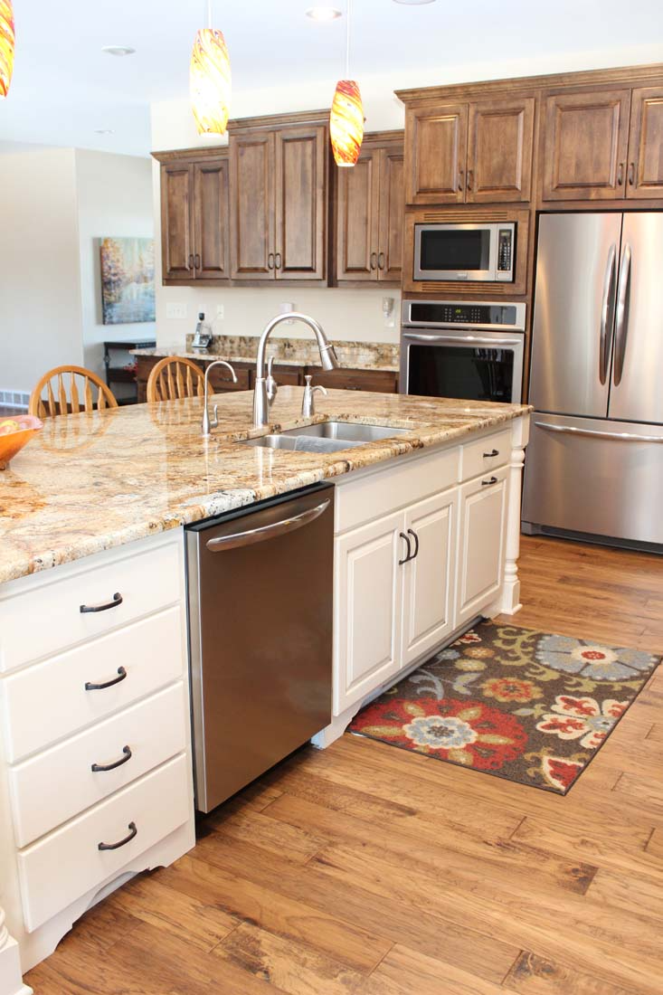 A kitchen with stainless steel appliances and granite counter tops