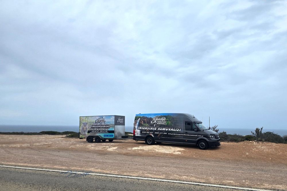 A Large Truck is Parked on the Side of the Road at Night — Gordy's Furniture Removals in Bathurst, NSW