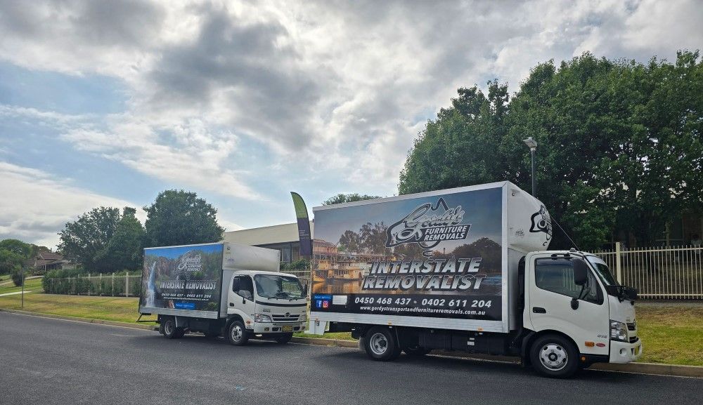 A Small Van Parked on the Side of the Road— Gordy's Furniture Removals in Blue Mountains, NSW