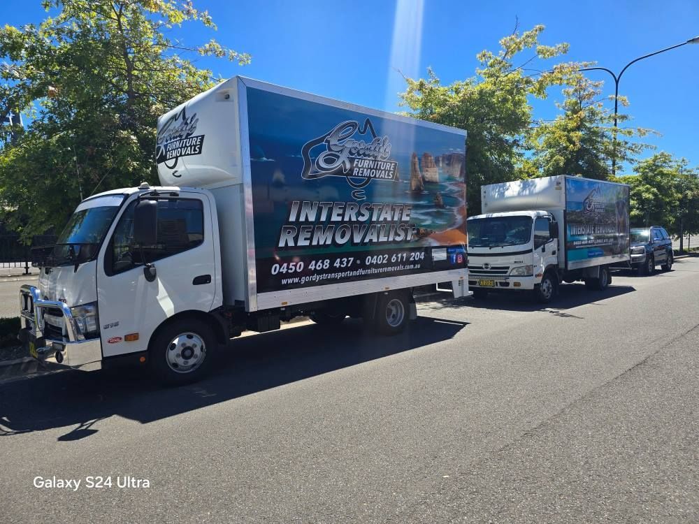 A Truck Is Parked On The Side Of A Highway — Gordy's Furniture Removals in Wollongong, NSW