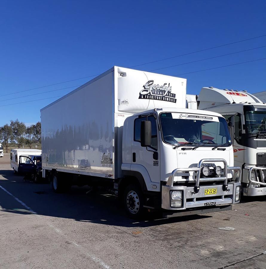 A White Truck Has A License Plate That Says S4h — Gordy's Furniture Removals in Bathurst, NSW