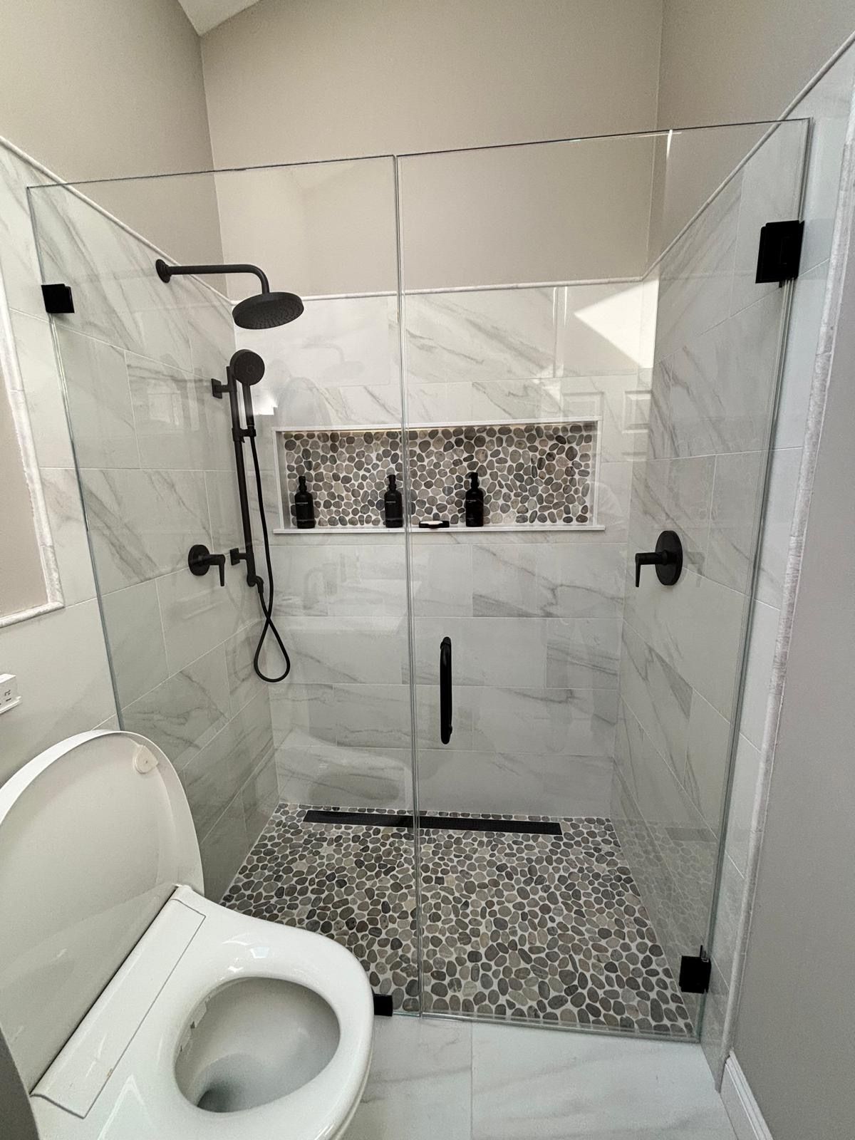 Accessible walk-in shower with bench, handheld showerhead, and tiled walls and floor