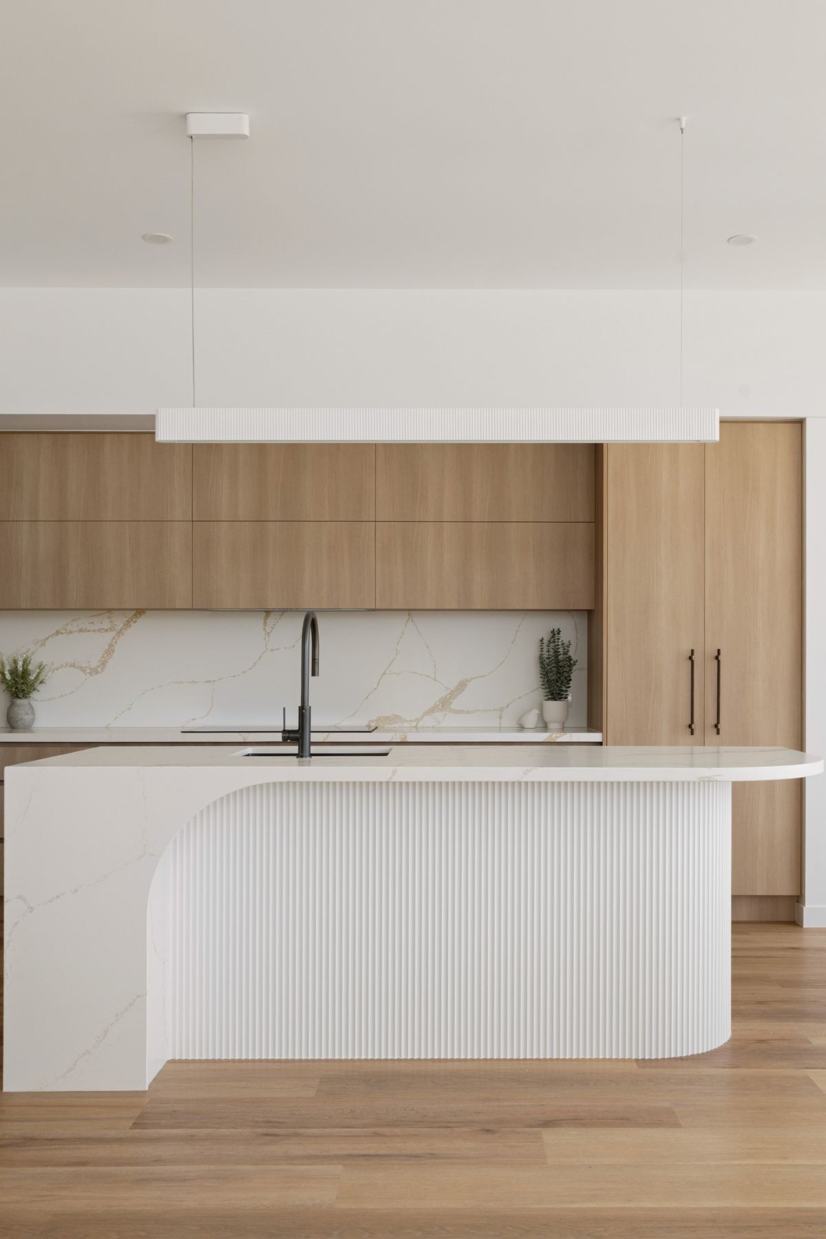 Modern Kitchen With Light Wood Cabinets — Foreshore Kitchens in Caloundra, QLD