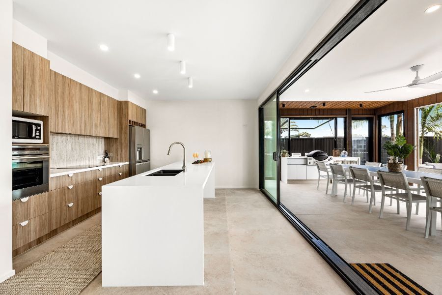 Modern Kitchen With Wood Cabinetry, a White Island — Foreshore Kitchens in Nambour, QLD