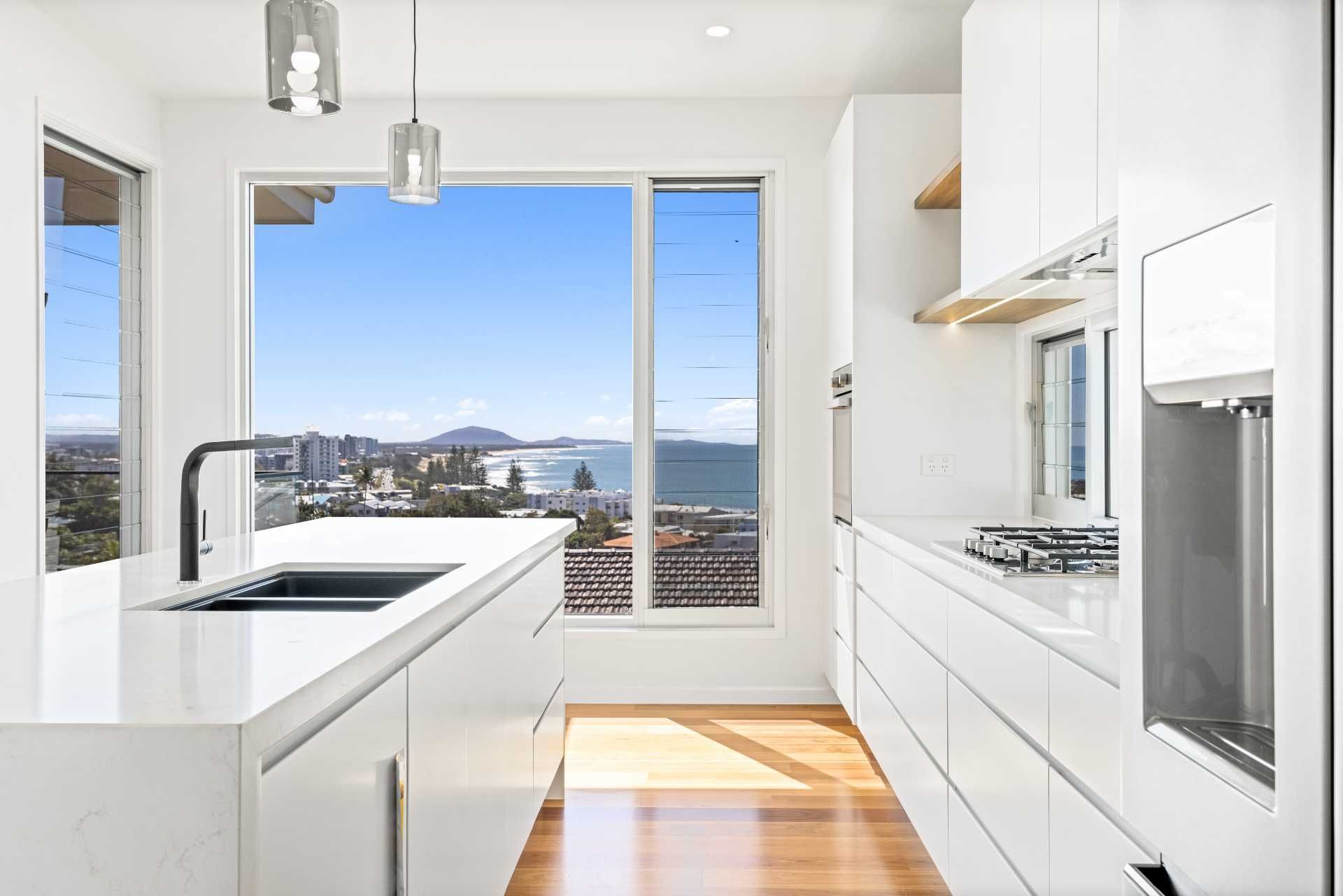 Modern White Kitchen With a Minimalist Island — Foreshore Kitchens in Noosa, QLD