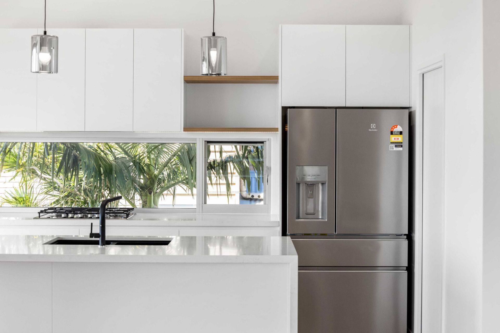 A Modern Kitchen Featuring White Cabinets — Foreshore Kitchens in Coolum, QLD