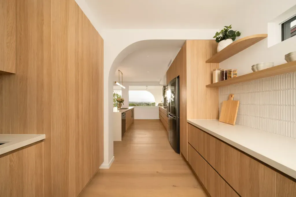 Modern Kitchen Hallway With Light Wood Cabinetry — Foreshore Kitchens in Coolum Beach, QLD