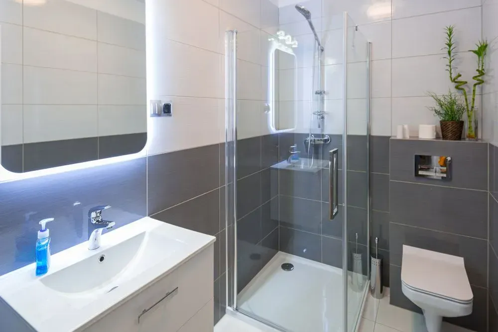 Modern Bathroom With White and Gray Tiles — Foreshore Kitchens in Coolum Beach, QLD