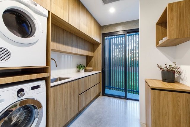 Modern Laundry Room With Wooden Cabinetry — Foreshore Kitchens in Coolum Beach, QLD