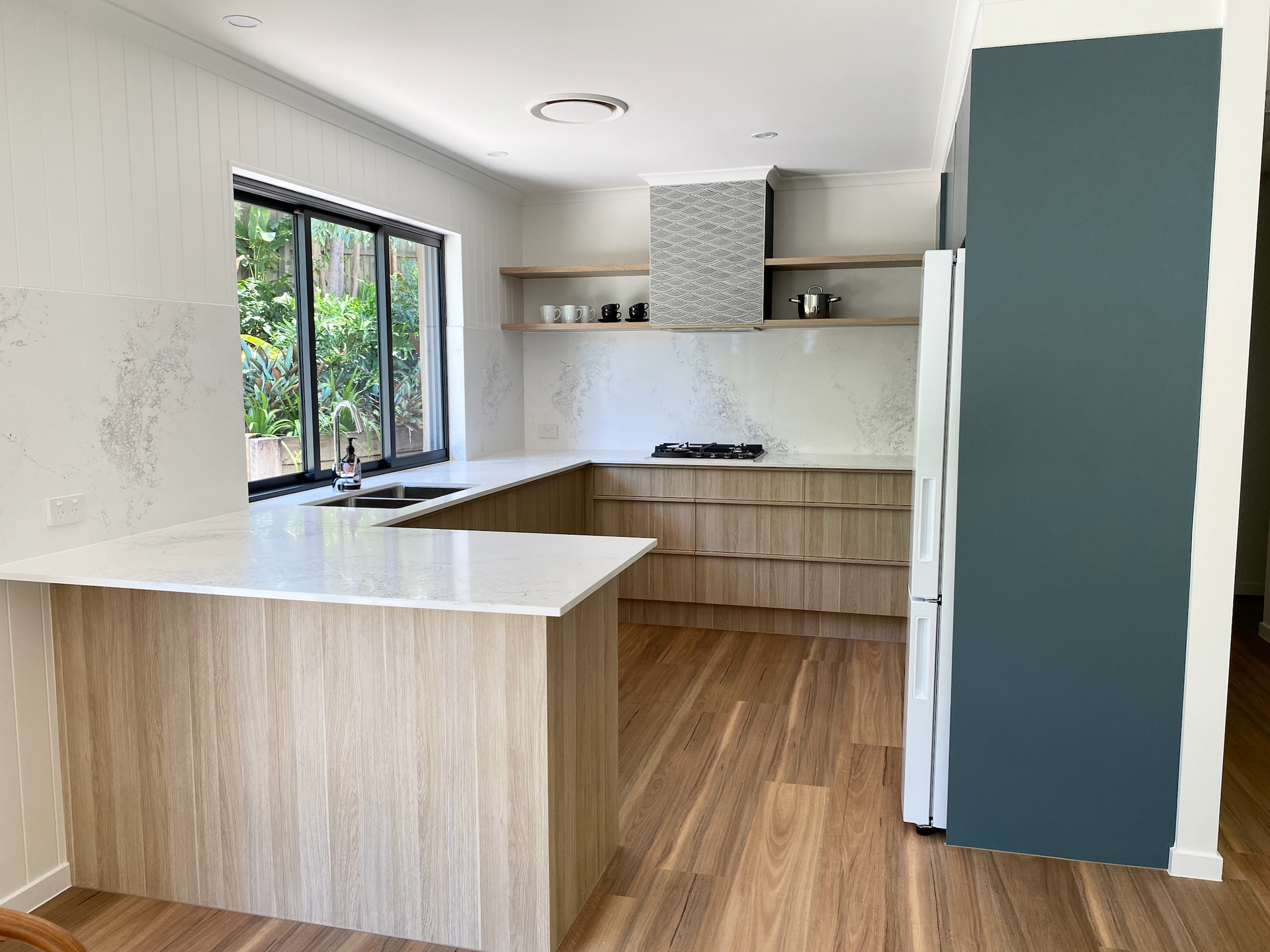 Modern L-shaped Kitchen With Light Wood Cabinets — Foreshore Kitchens in Coolum Beach, QLD