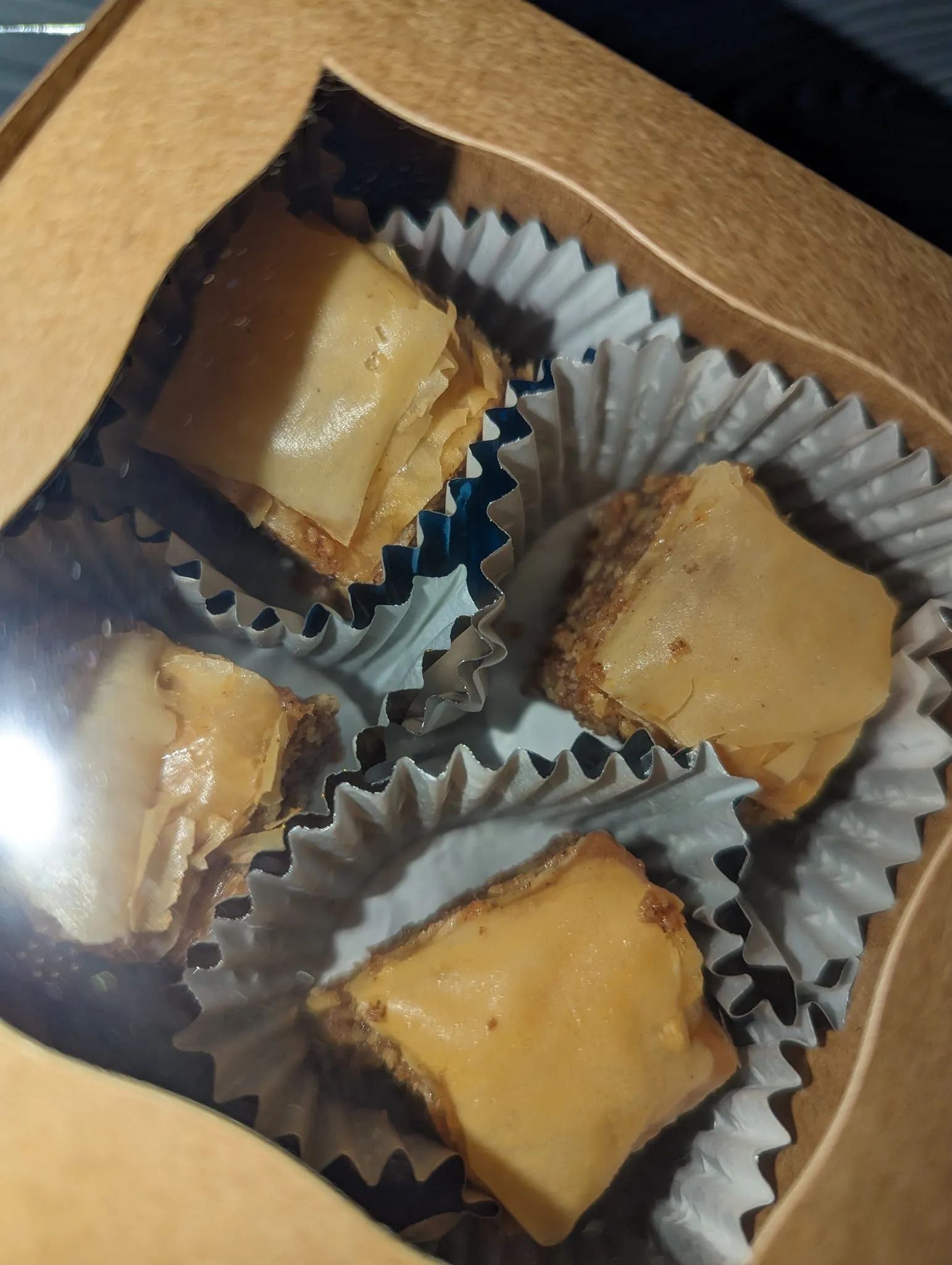 A box of peanut butter brownies in cupcake liners