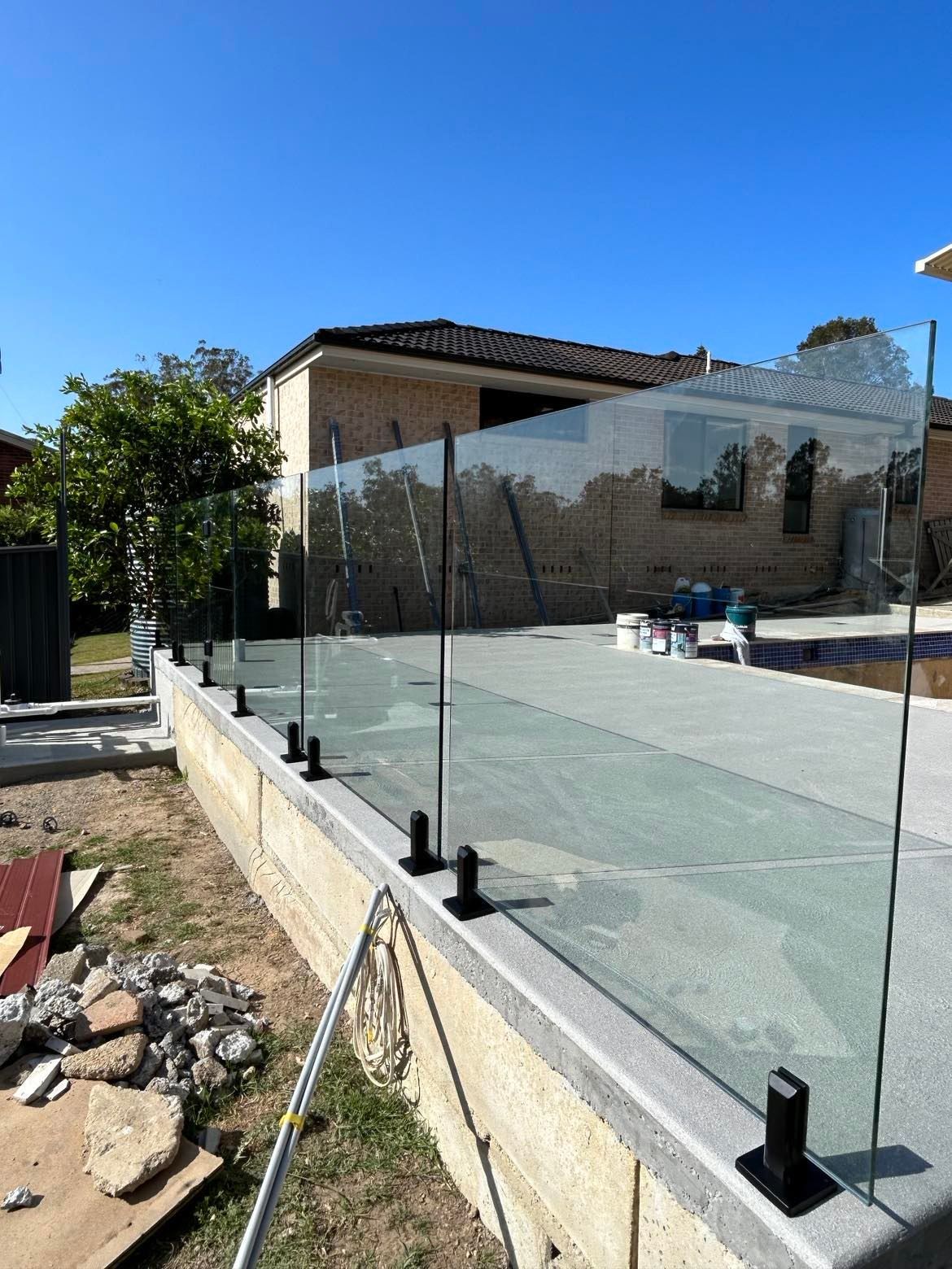 Glass Panel Fence on A Concrete Retaining Wall — Envy Glass in Nambucca Heads, NSW
