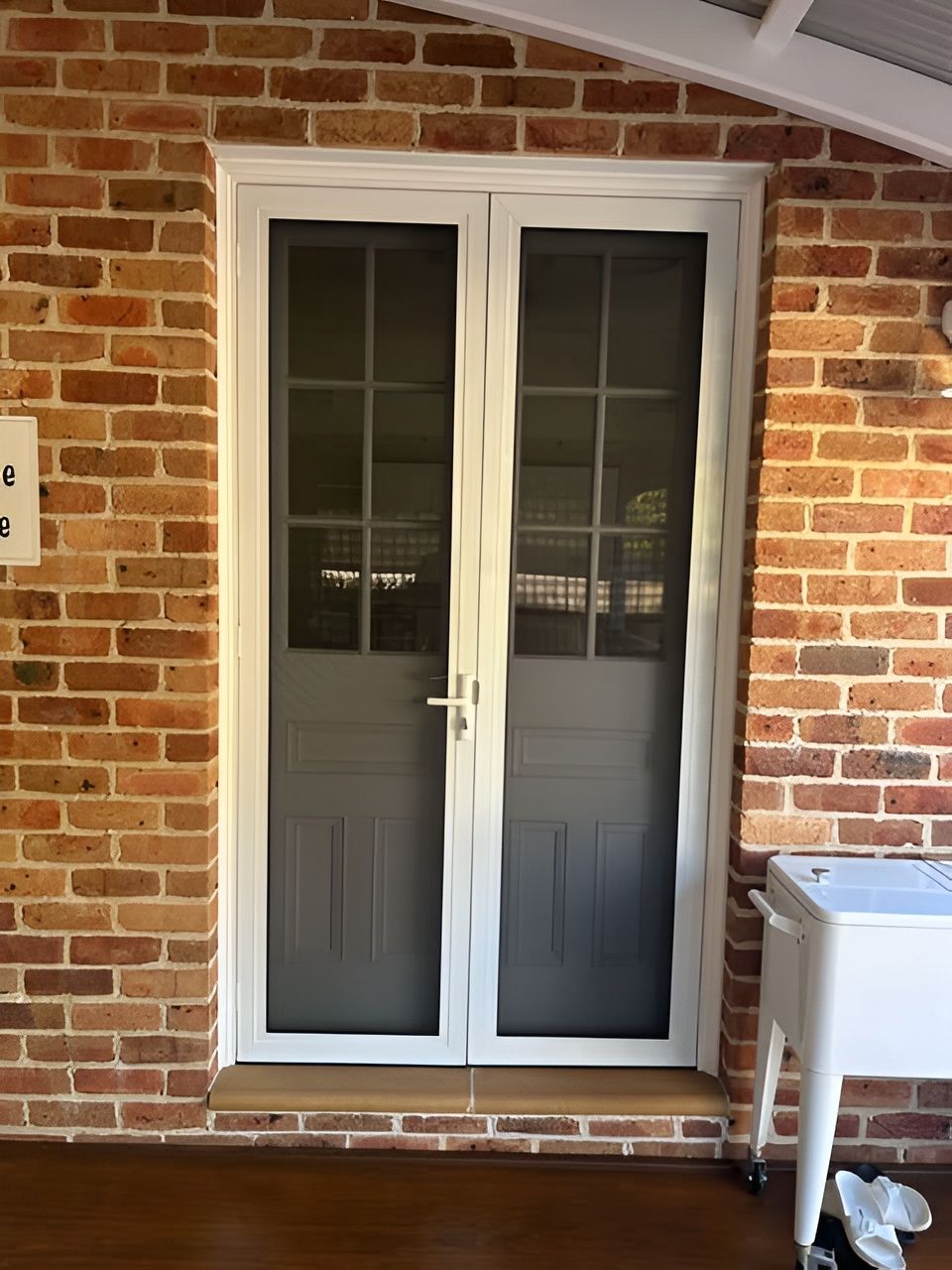 White Double Doors with Screen Doors Set in A Brick Wall — Envy Glass in Nambucca Heads, NSW