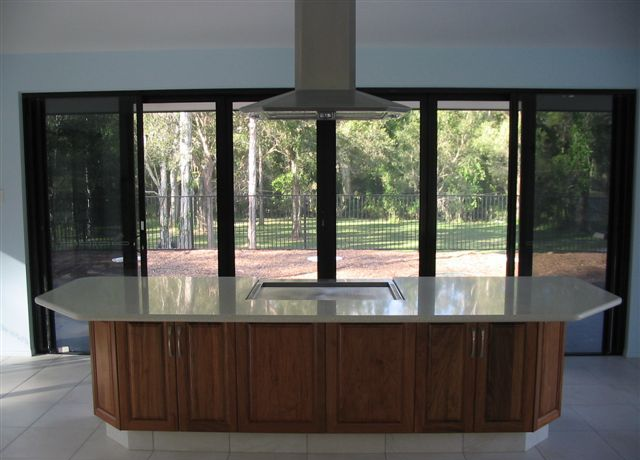 Kitchen Island With Stovetop, Wooden Cabinets, And Large Windows — Envy Glass in Nambucca Heads, NSW