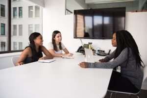 Picture Of Three People On The Table | Murphy, TX | EG Insurance Group