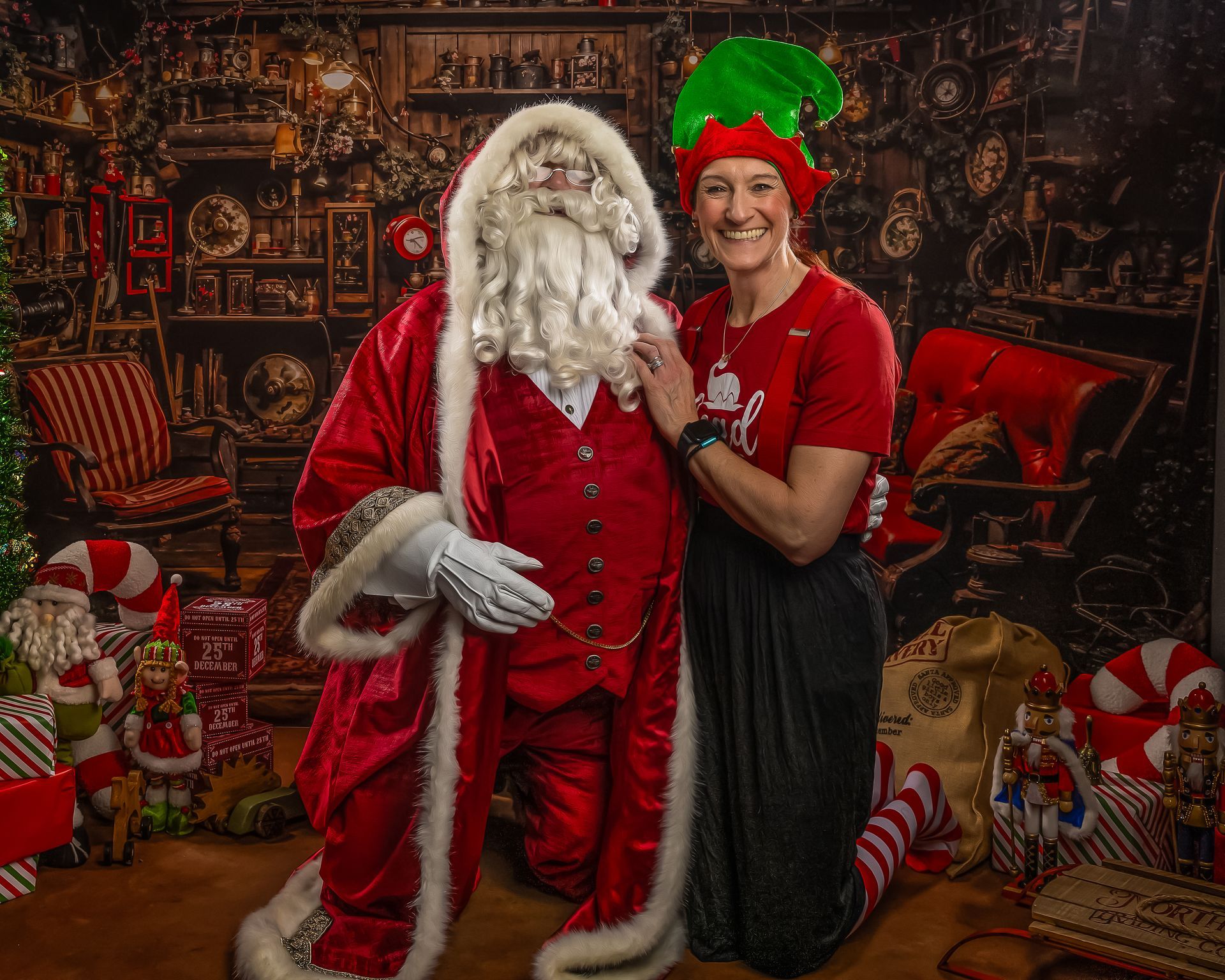 Children laughing with Santa Claus in a festive room.