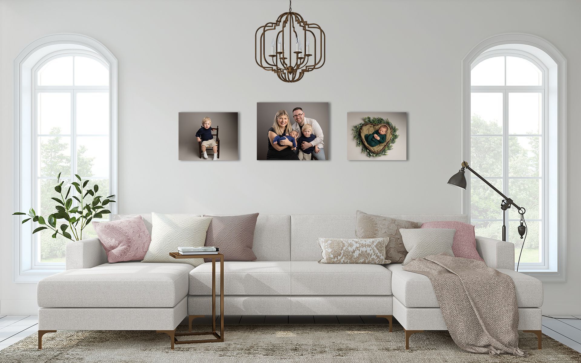 Living room with white sofa, photos on wall, arched windows.