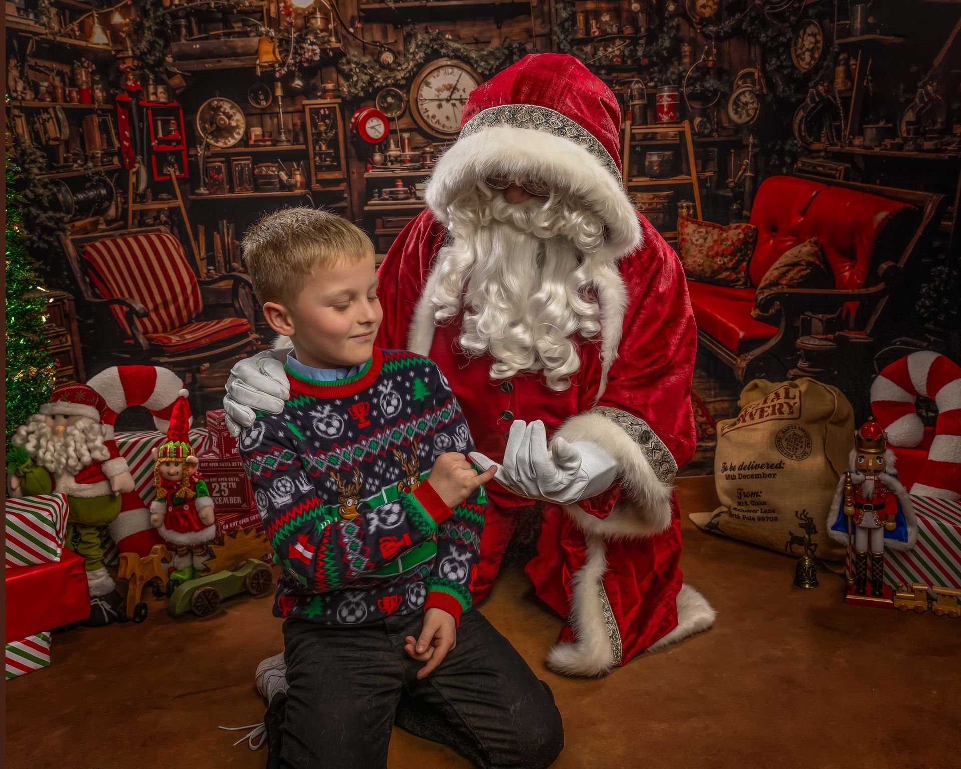 Santa Claus with children, a woman, and Christmas decorations indoors. Children look surprised.